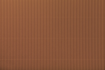 Texture of corrugated dark brown paper, macro.