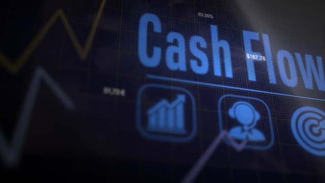 Cash Flow business concept on a flashing computer monitor with moving graphs and data.