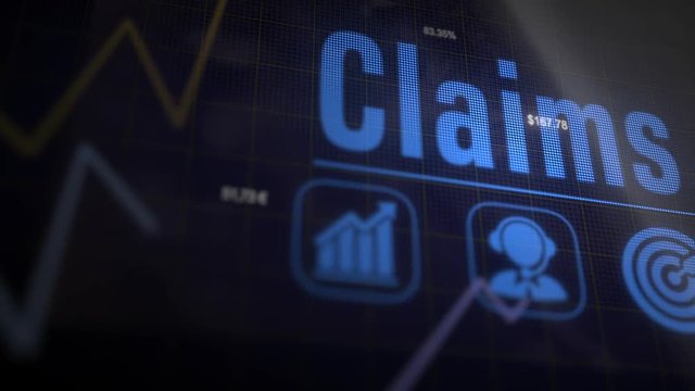 Claims business concept on a flashing computer monitor with moving graphs and data.