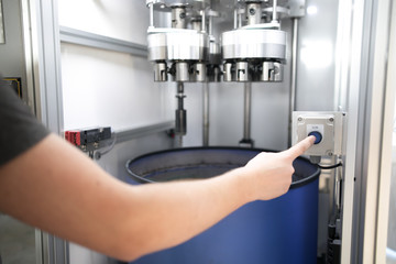 Engineer Operating CNC Machinery On Factory Floor
