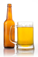Beer glass and bottle on the white background