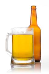 Beer glass and bottle on the white background