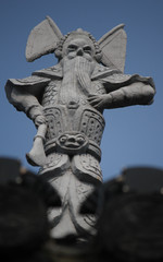 Historic and heroic stone sculpture as roof top decoration in old town Suzhou city, China, Asia
