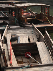 Fototapeta na wymiar Tourist boats on a pier waiting to be prepared for touristic trips through the channels of Pinjiang historic quarter in old town Suzhou, China, Asia