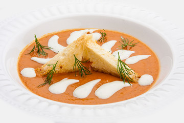 Pumpkin cream-soup in bread with bacon