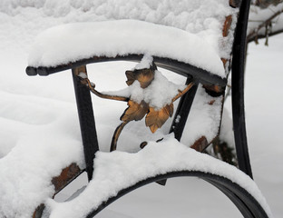 decorative element of metal leaves on a bench