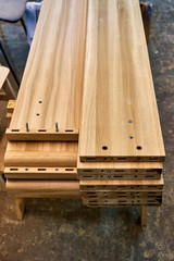 Fototapeta premium Wooden elements of a double bed. Furniture manufacture. Close-up