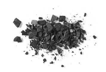 Black charcoal pile isolated on white background, top view