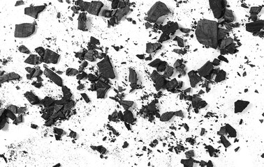 Black charcoal pile isolated on white background, top view