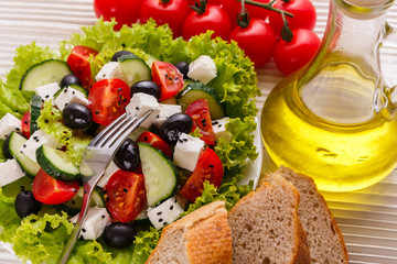 Greek salad on a wooden rustic background