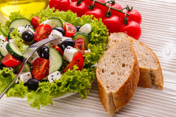 Greek salad on a wooden rustic background