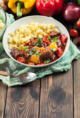 Hungarian beef goulash serwed with galuska noodles