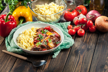 Hungarian beef goulash serwed with galuska noodles