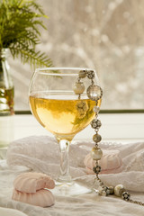 glass of sparkling by the window .Women's day concept