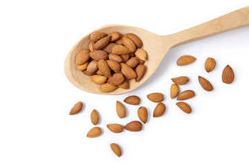 Pelled almonds in woodeen spoon. Cut out.