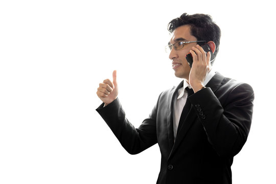 Asian businessman using mobile phone texting isolated in white background.
