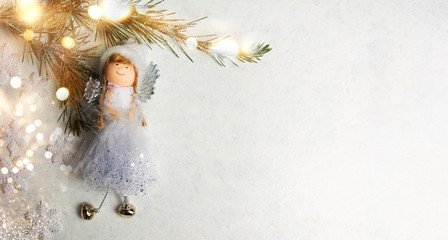 Toy angel and Christmas background