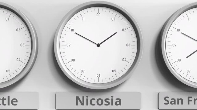 Round clock showing Nicosia, Cyprus time within world time zones. 3D animation