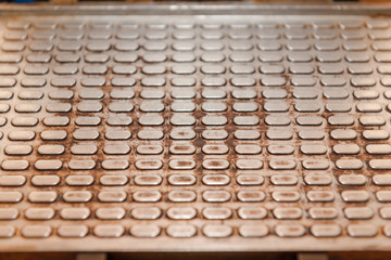 Metallic background. The texture of the metal. Metal squares. Corrugated metal.