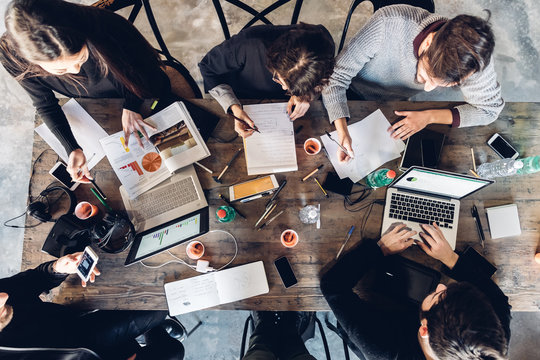 Designers having meeting in studio - Powered by Adobe