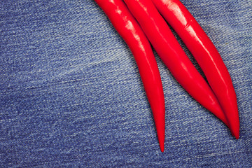 red pepper on jeans background