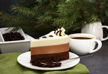 Three chocolate mousse cake slice on a small plate.  Amazing dessert