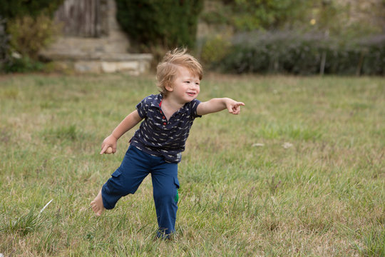 Boy eagerly pointing with finger
