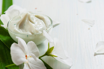 Naklejka na ściany i meble Cosmetic cream white flower