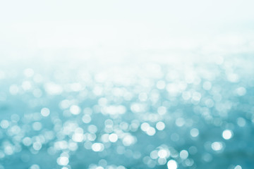 Blur beach with bokeh blue color background.