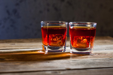 two glasses of old whiskey