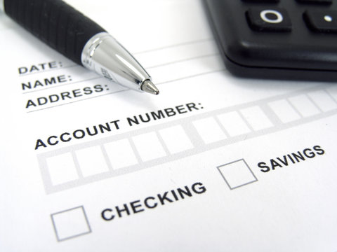 Deposit slip with pen and calculator