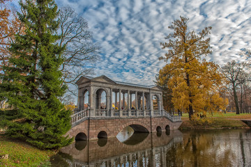 Marble bridge in autumn foliage in Catherine park (Pushkin), St. Petersburg, Russia