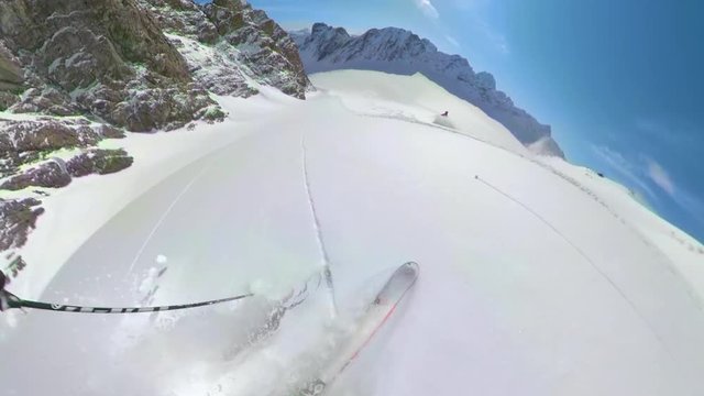 BELLA COOLA HELISKIING, BRITISH COLUMBIA, CANADA, MARCH 2018: POV 360VR: Freeride skiing down the untouched terrain of a remote mountain in picturesque Canadian wilderness. Riding in fresh powder snow