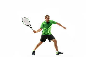 Obraz na płótnie Canvas The one caucasian man playing tennis isolated on white background. Studio shot of fit young player at studio in motion or movement during sport game..