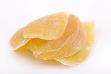 Candied fruit mango in sugar on a white background.