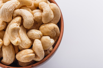 cashew nuts on a white acrylic background