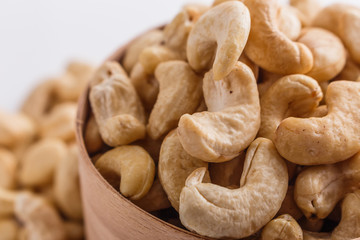 cashew nuts on a white acrylic background