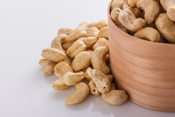 cashew nuts on a white acrylic background