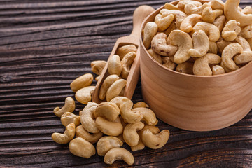 cashew nuts on a rustic wooden background