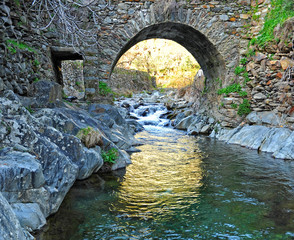 Medieval stone bridge over the river Hurdano in Casarrubia village. Las Hurdes is a mountanious region of the north of Caceres province, Extremadura, Spain