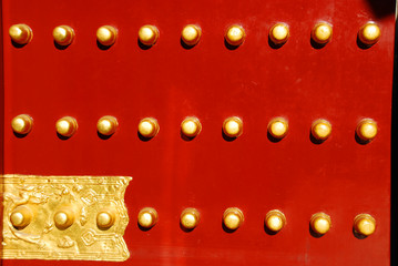 Chinese red door with golden knobs 