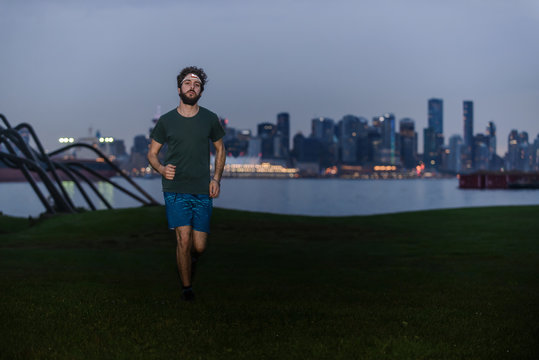 Runner with headlamp in urban North Vancouver, Canada