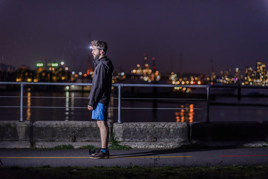 Runner with headlamp in urban North Vancouver, Canada