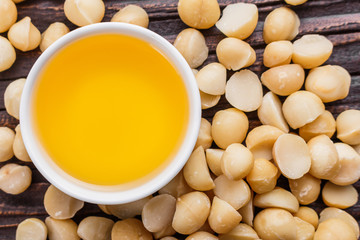 delicious macadamia nuts on a wooden rustic background