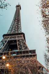 Eiffel Tower in the morning against a cloudy sky in winter