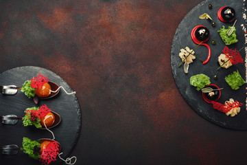 Molecular modern cuisine galantine duck in spoons on stone and rusty background