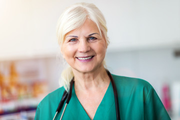 Senior female doctor smiling at the camera