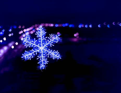 snowflake on colorful bokeh background, snowflake with blurred background.
