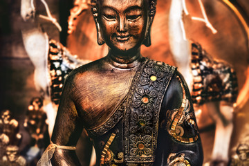 buddha meditating yoga background bronze orange statue