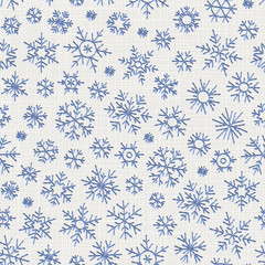 Seamless embroidery snowflakes background.